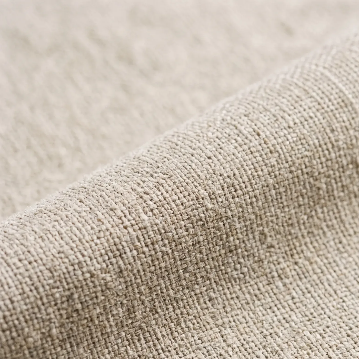 Fine polyester micro weave in warm greige, one soft fold across the frame